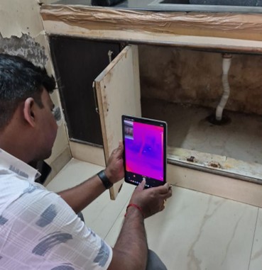 Bosch moisture meter being used on commercial walls